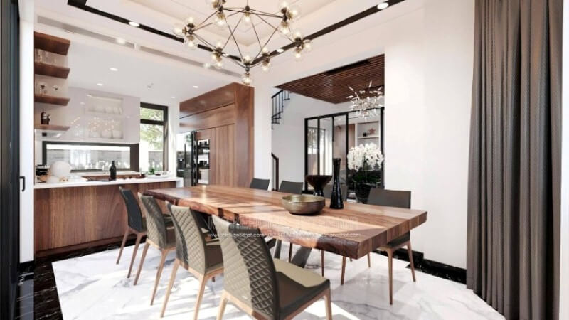 Ngoài điểm đặc biệt từ cách bố trí kệ trang trí, bàn đảo bằng đá nhân tạo LG màu trắng được thiết kế phô ra ngoài lại là điểm đáng chú ý, một mặt vẫn đảm bảo diện tích để chủ nhân có thể trưng bày món ăn thỏa mái, một mặt bạn lại có thể vừa nội trợ vừa có thể trông nom con học một cách dễ dàng. Tủ bếp gỗ công nghiệp và tủ bếp acrylic